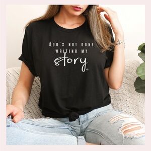 Gods not done writing my story shirt